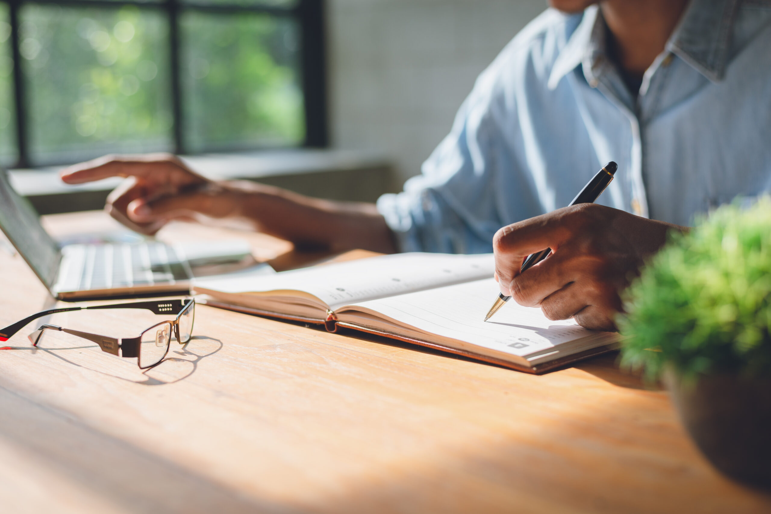 Image of businessman working at work table,home office desk back